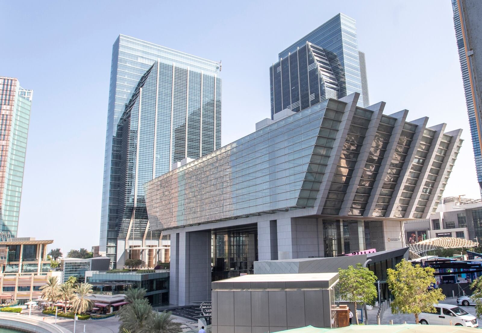 ADGM headquarters building with angled glass fins on Al Maryah Island in Abu Dhabi, with office towers behind