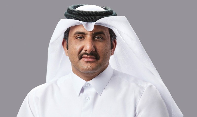 Portrait of Ahli Bank chairman Sheikh Faisal Bin AbdulAziz Bin Jassim Al-Thani in a white thobe and ghutra against a gray background