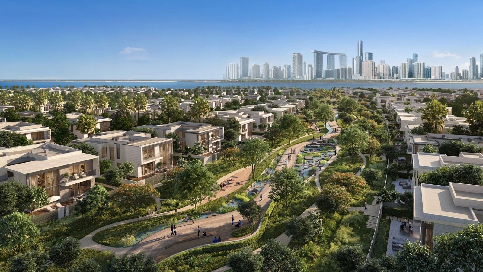 A rendering of a landscaped Aldar residential community in Abu Dhabi with villas, walkways and a city skyline in the distance