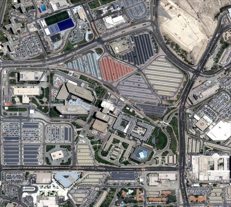 Satellite view of Saudi Aramco's headquarters complex in Dhahran with office buildings, roads and parking areas