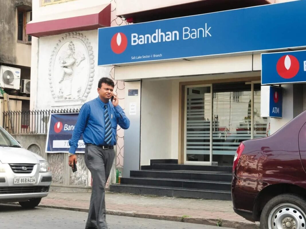 A man walks past a Bandhan Bank branch in India