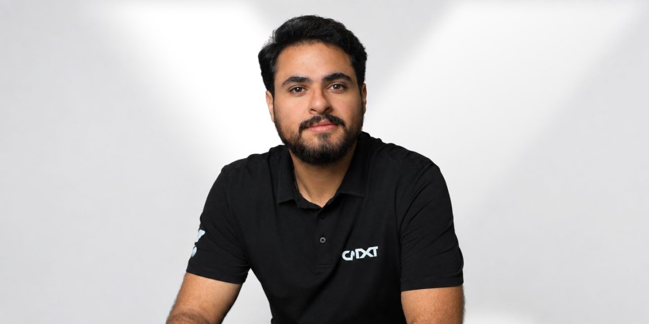 CNTXT AI chief executive Mohammad Abu Sheikh in a black company polo shirt against a light gray background