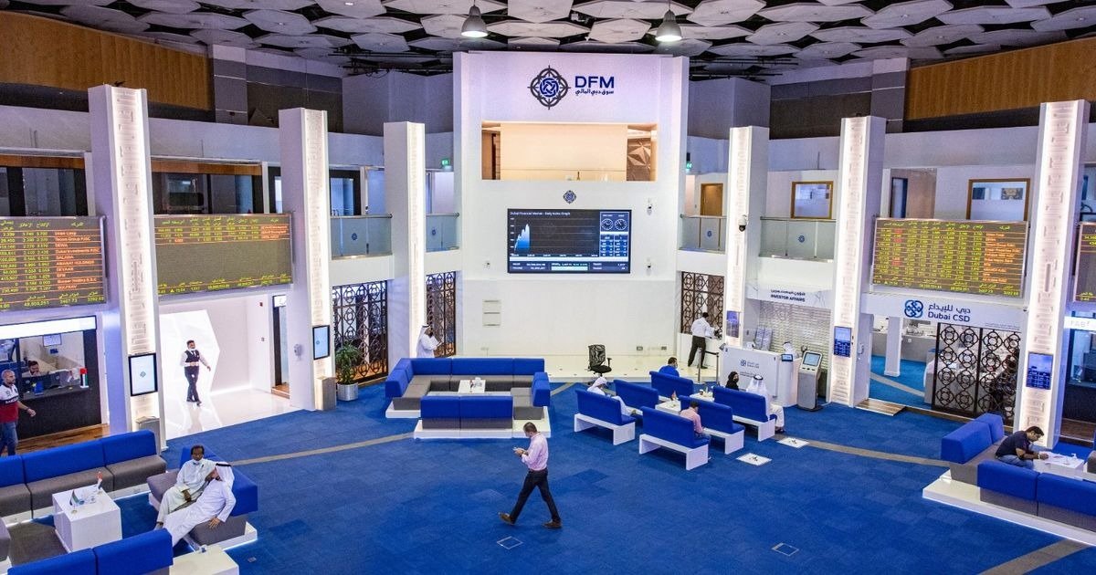 The trading floor of the Dubai Financial Market with price boards and seating areas