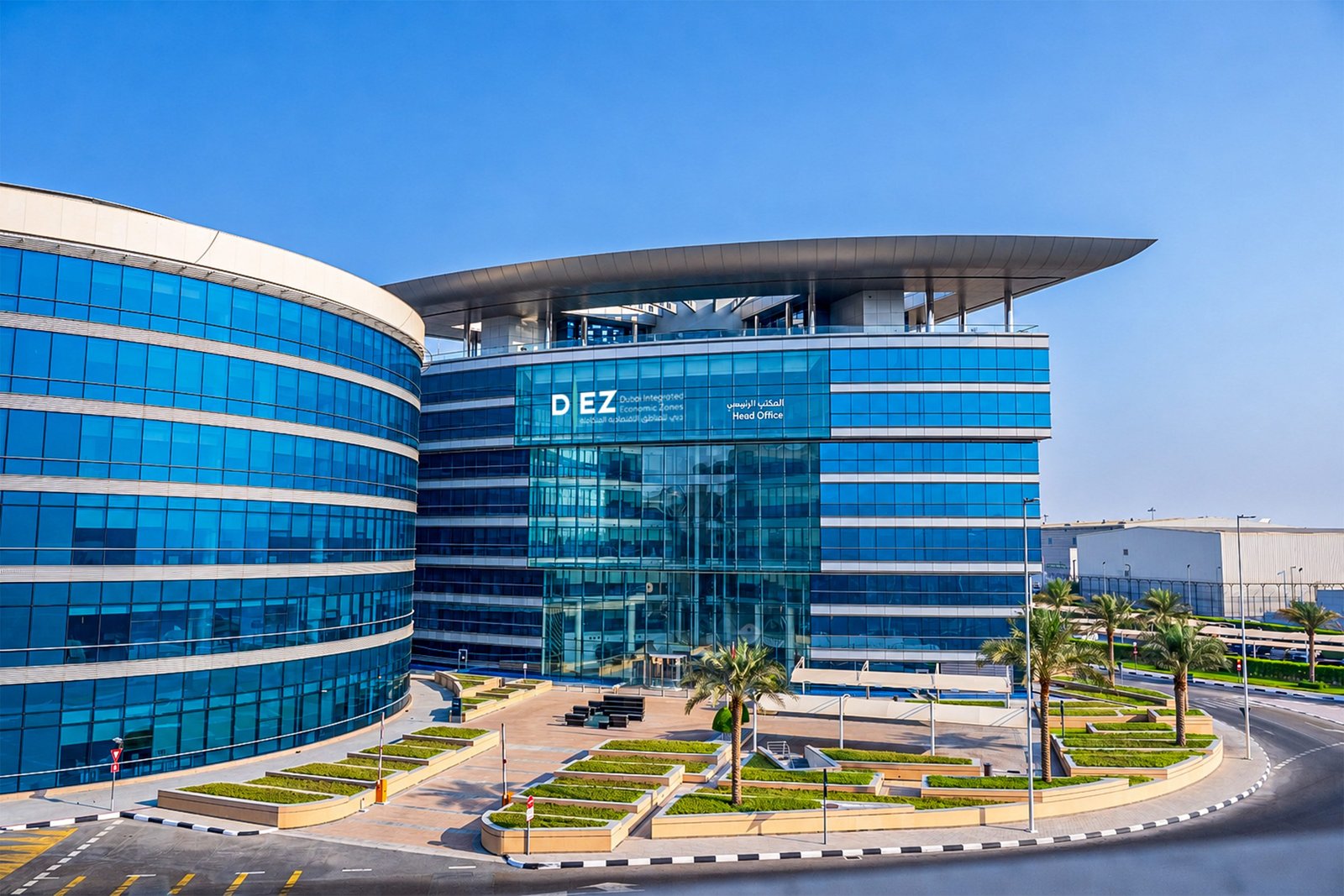 The Dubai Integrated Economic Zones Authority head office building in Dubai, with glass facades and palm trees in front
