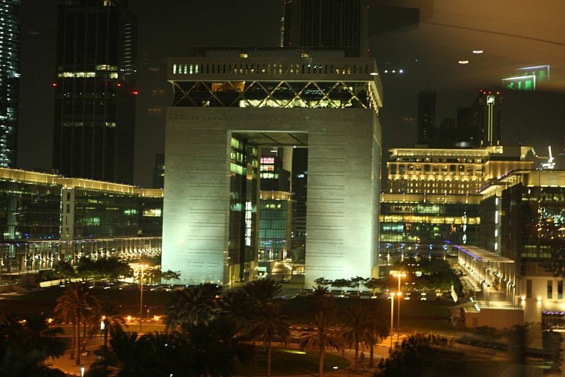 The Gate building at the Dubai International Financial Centre lit up at night