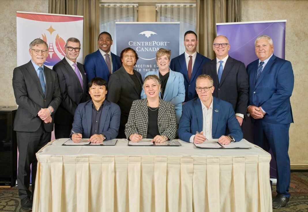 Representatives of Arctic Gateway Group, CentrePort Canada and DP World at a signing table