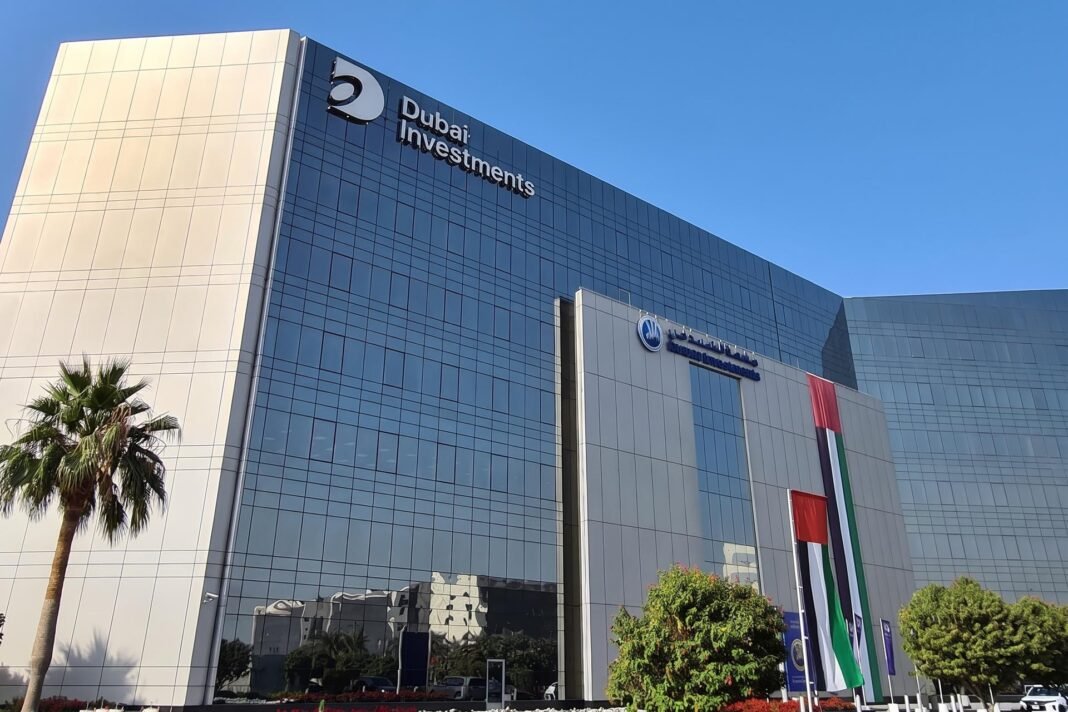 The Dubai Investments headquarters building in Dubai with UAE flags in front