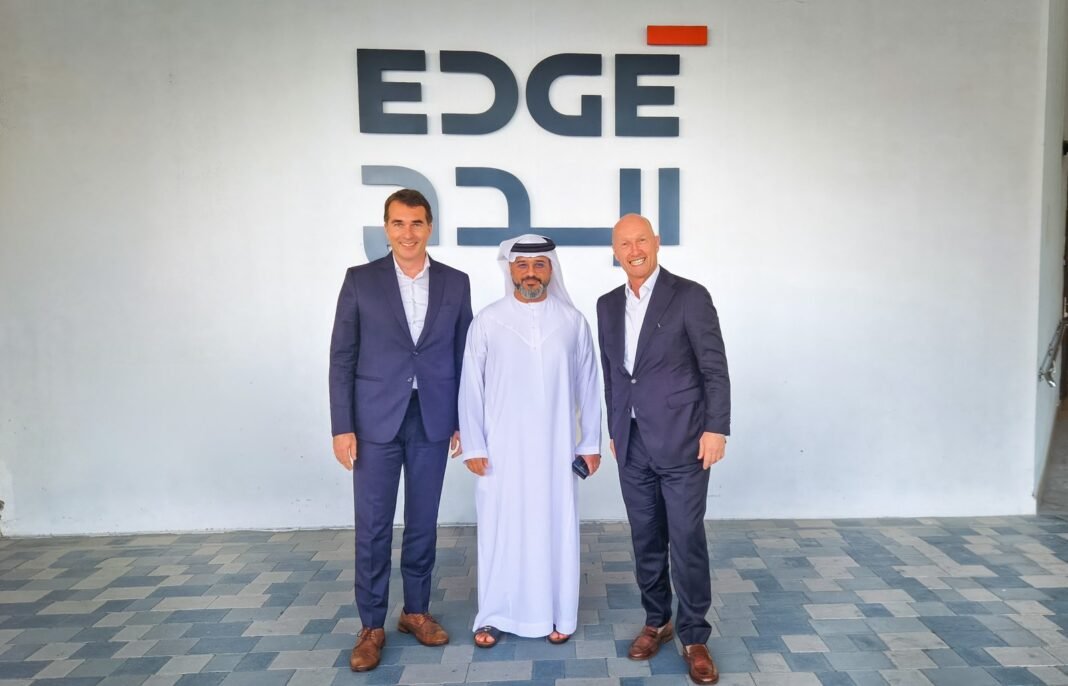 Executives from SFC Energy and EDGE in front of the EDGE sign in the UAE