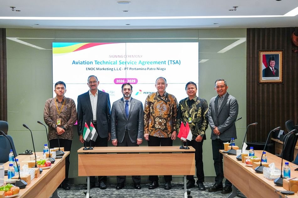 ENOC and Pertamina Patra Niaga officials stand in front of a screen reading Aviation Technical Service Agreement 2026-2029