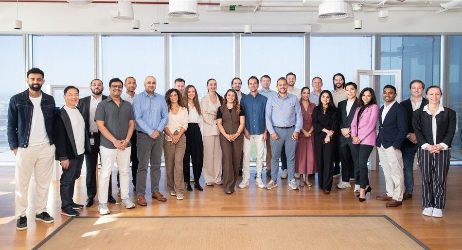 Group photo of people in an office released by Hub71 with its Cohort 19 announcement