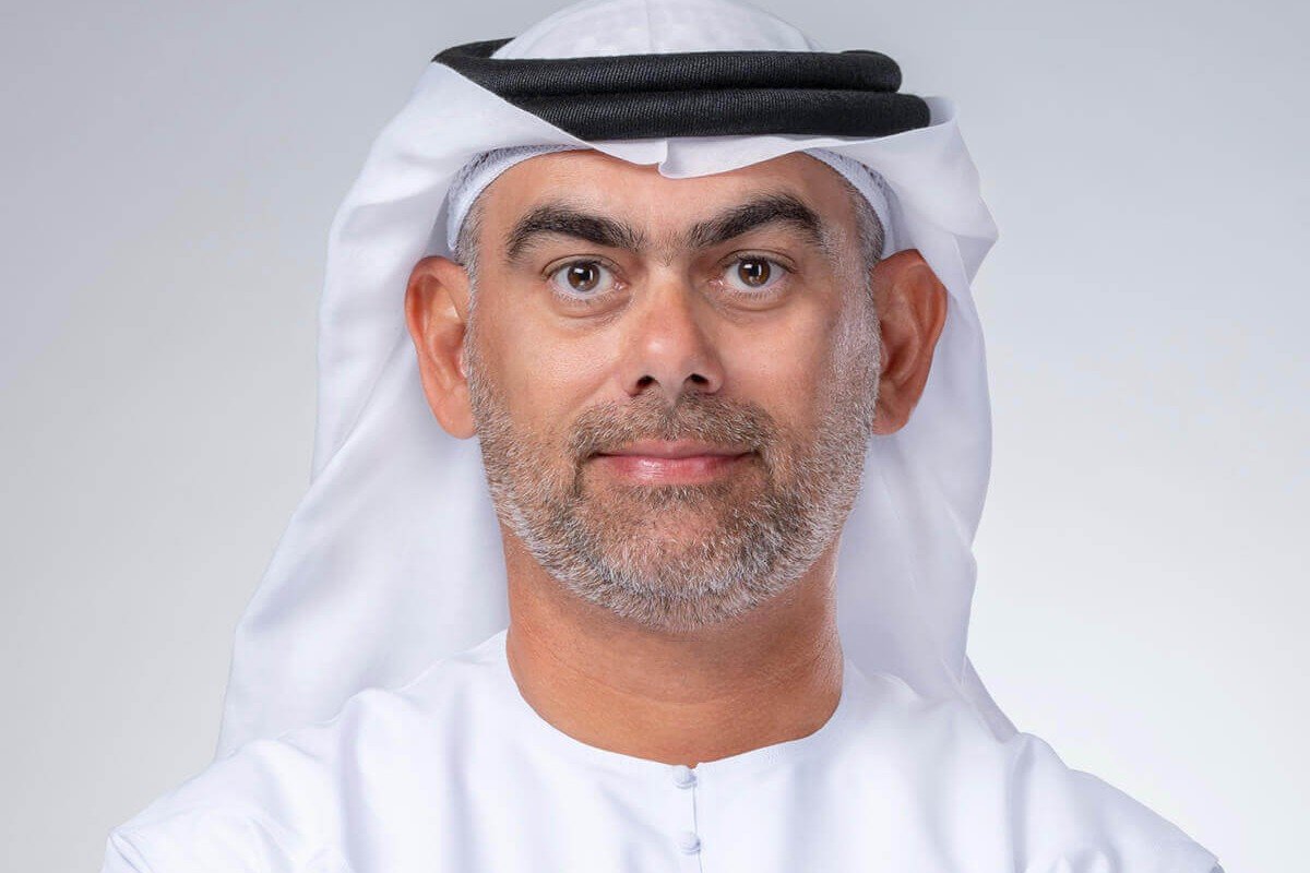 Portrait of Jasim Husain Thabet, Group Chief Executive Officer and Managing Director of TAQA, wearing a white kandura and ghutra