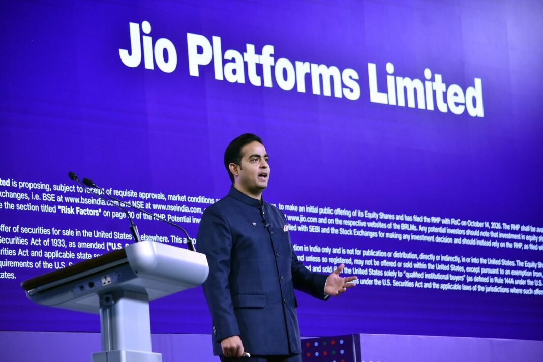 Jio Platforms managing director Akash Ambani speaking at a podium in front of a screen reading Jio Platforms Limited