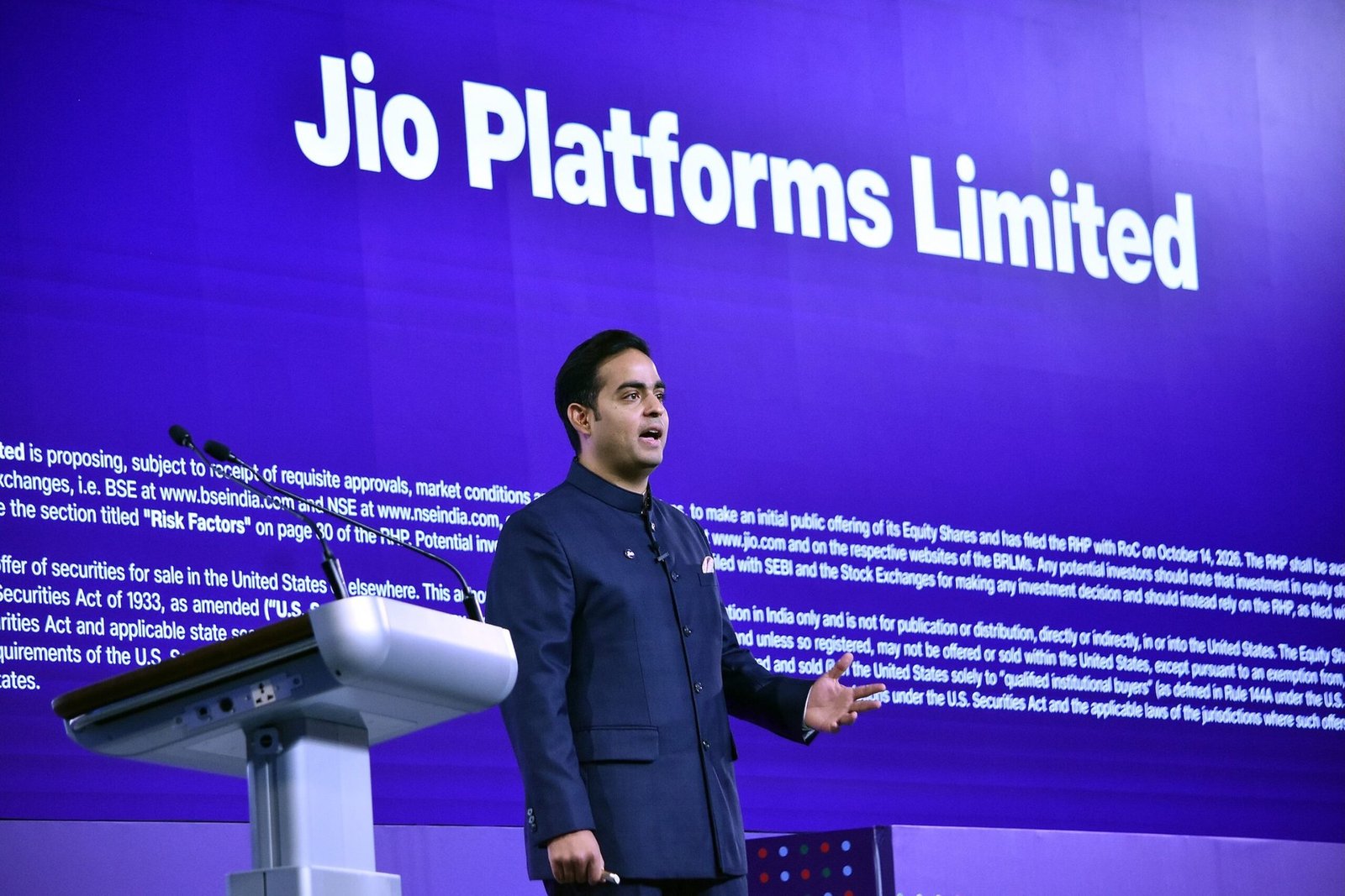 Jio Platforms managing director Akash Ambani speaking at a podium in front of a screen reading Jio Platforms Limited