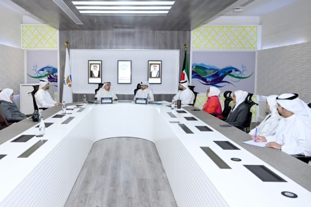 Officials seated around a conference table at Kuwait's Public Authority for Youth and Sports