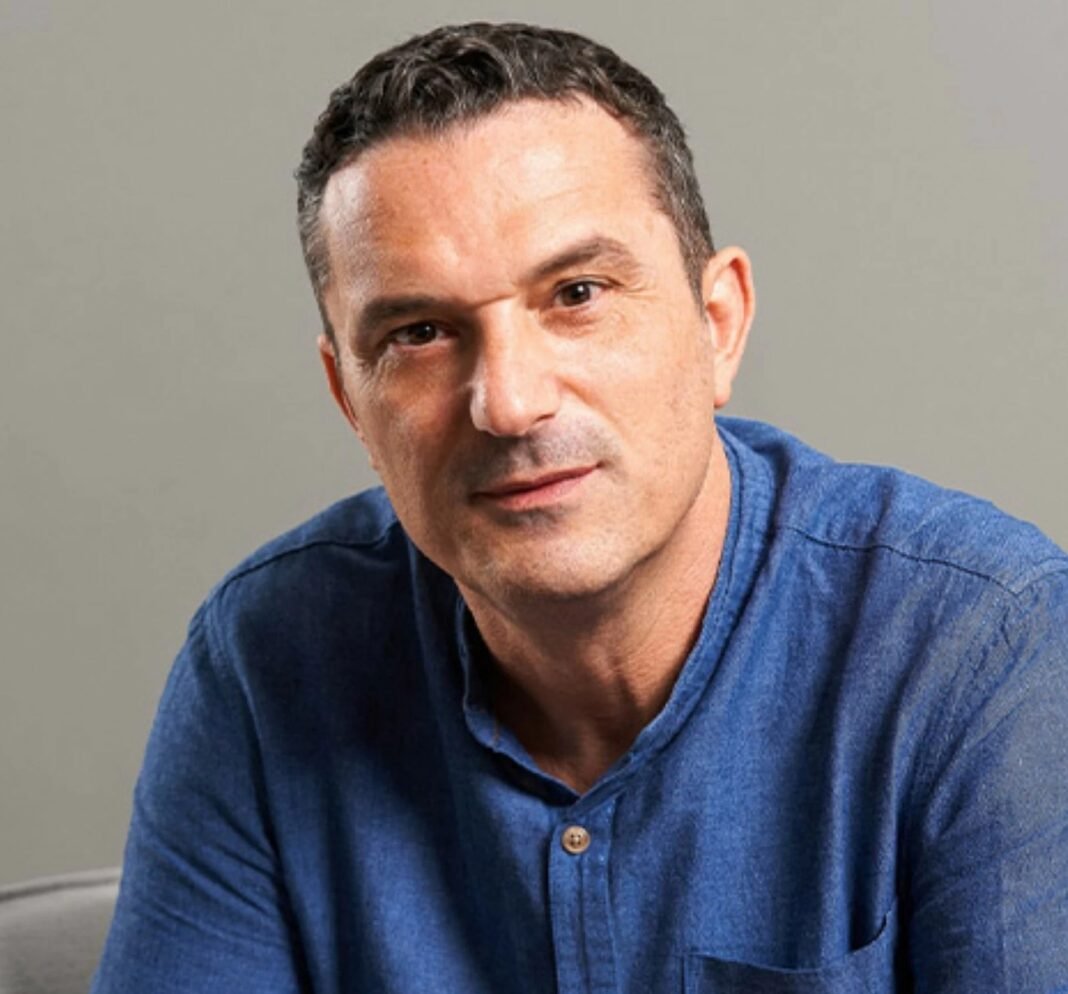 Alex Haywood, founder and chief executive of MetisJean, seated in front of a gray backdrop