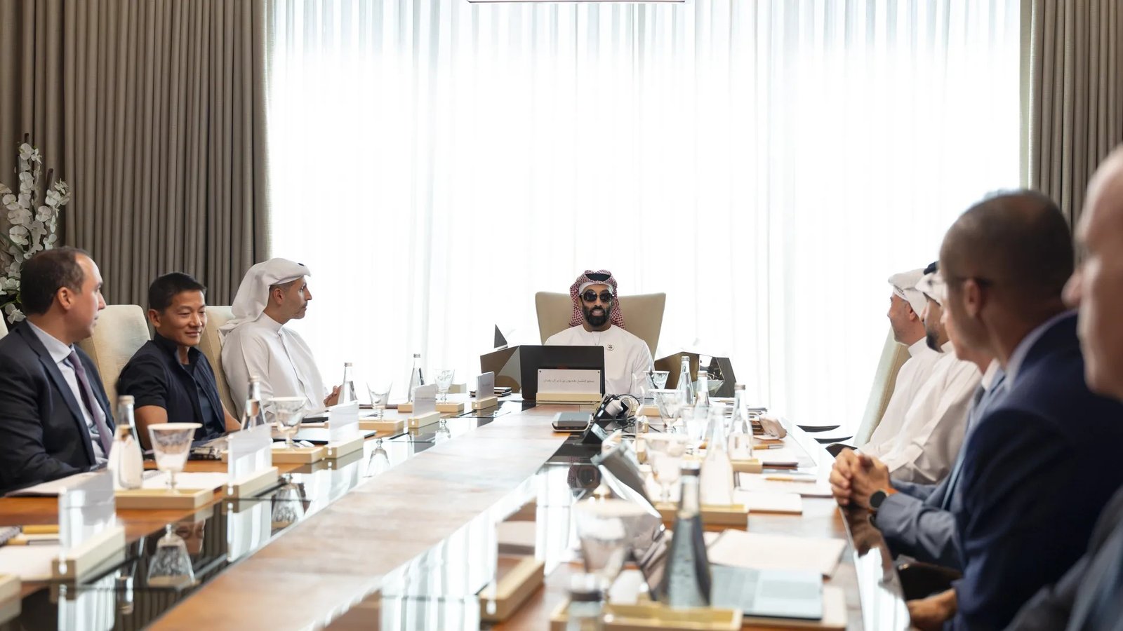 Sheikh Tahnoon bin Zayed at the head of a long boardroom table during an MGX board meeting