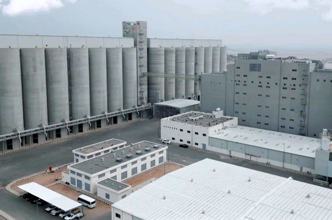 Aerial view of a Modern Mills milling facility with grain silos and warehouses