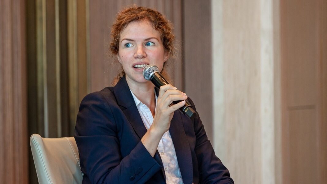 Nabta Health founder Sophie Smith speaking into a microphone while seated