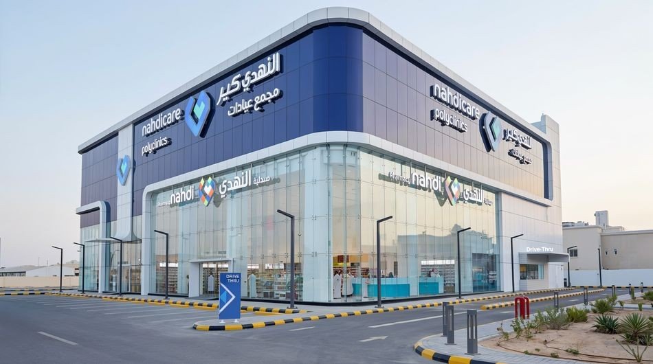 A Nahdi pharmacy and Nahdi Care polyclinic building with a drive-thru lane in Saudi Arabia