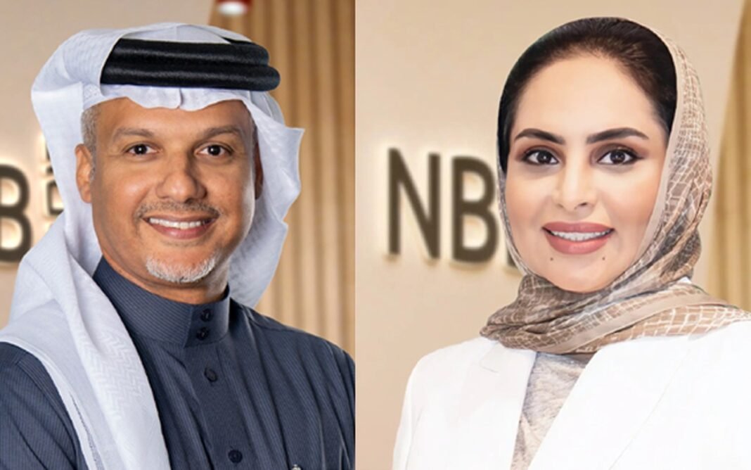 Portraits of National Bank of Bahrain executives Husain Almohri and Zaina Al Zayani in front of NBB signage