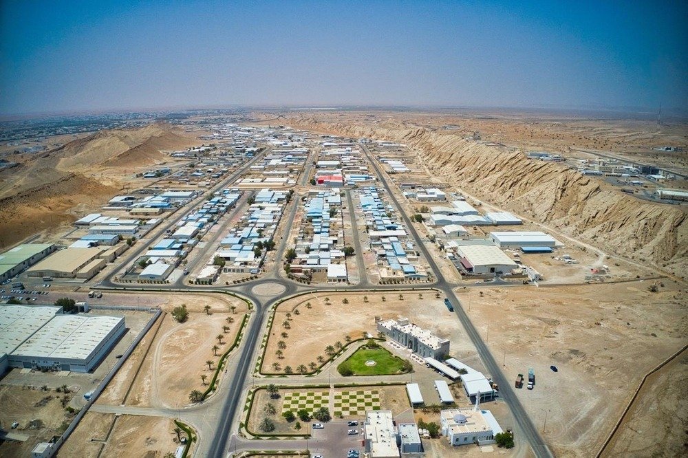 Aerial view of an industrial area with warehouses and factories in Oman