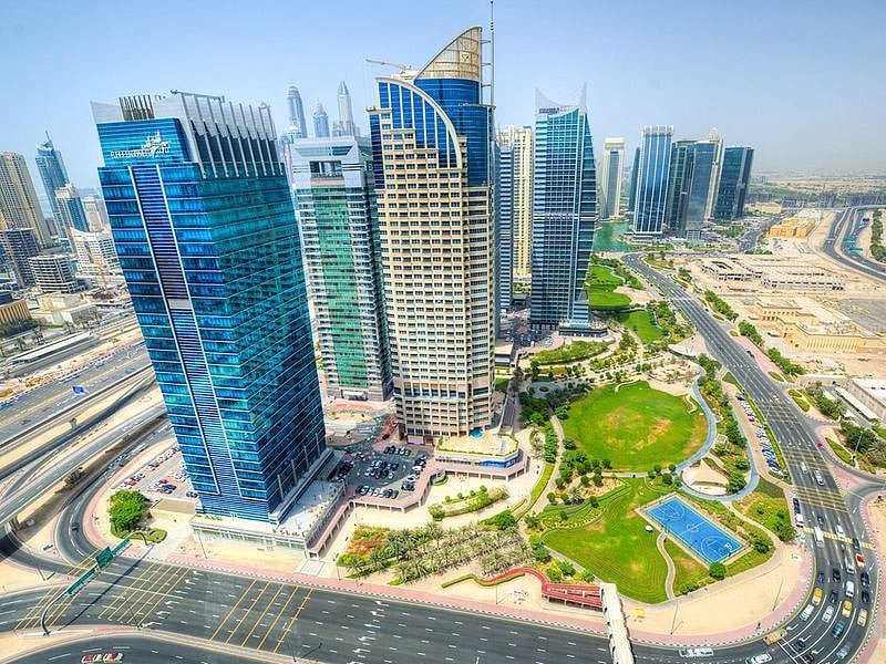 Aerial view of towers, roads and parking areas in Jumeirah Lakes Towers, Dubai