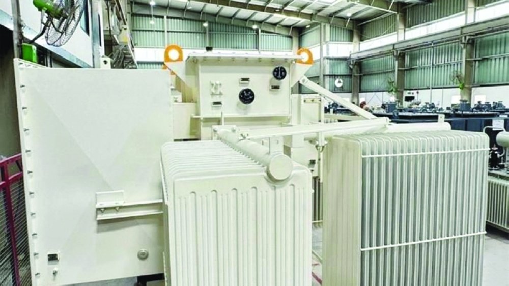 An electrical power transformer in a factory hall