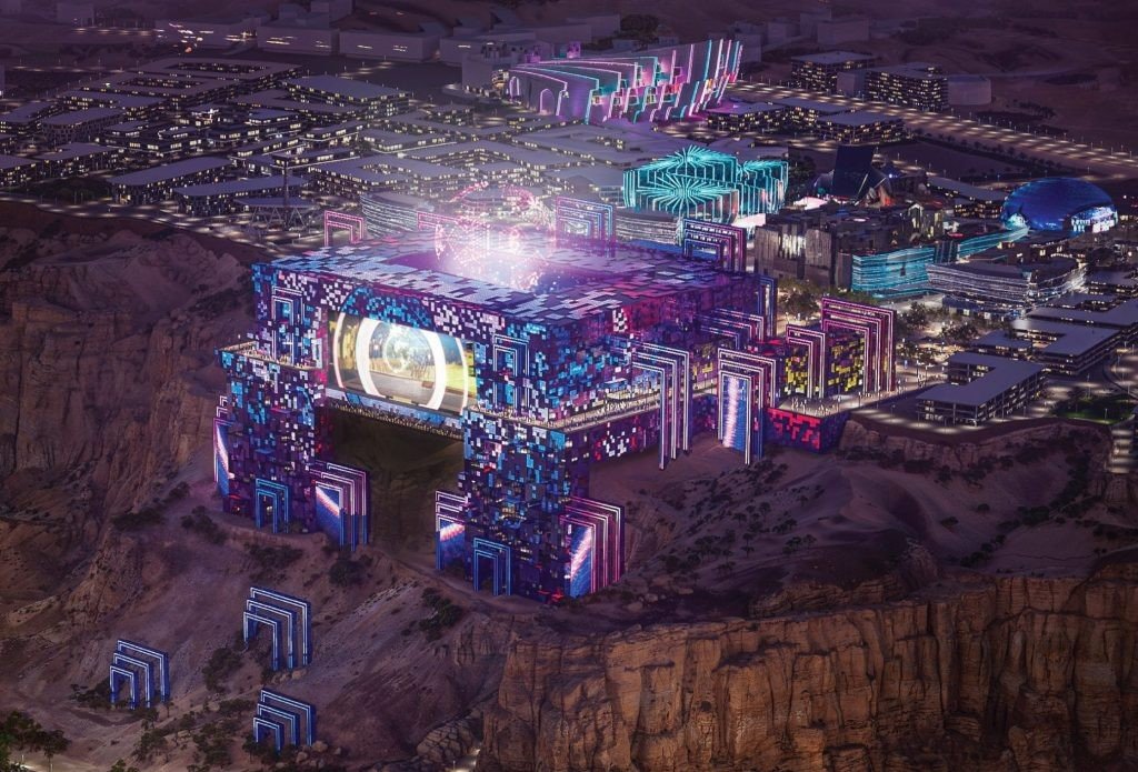 Night rendering of the Prince Mohammed bin Salman Stadium lit up on the edge of the Tuwaiq cliff in Qiddiya
