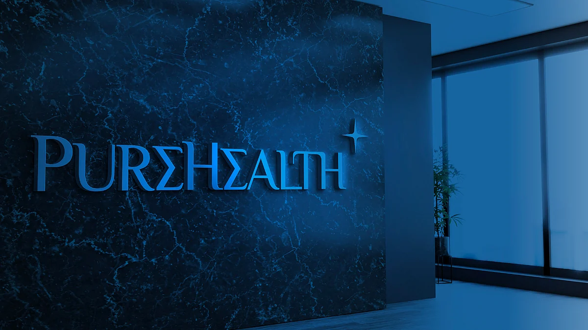 PureHealth sign on a marble wall in a company office