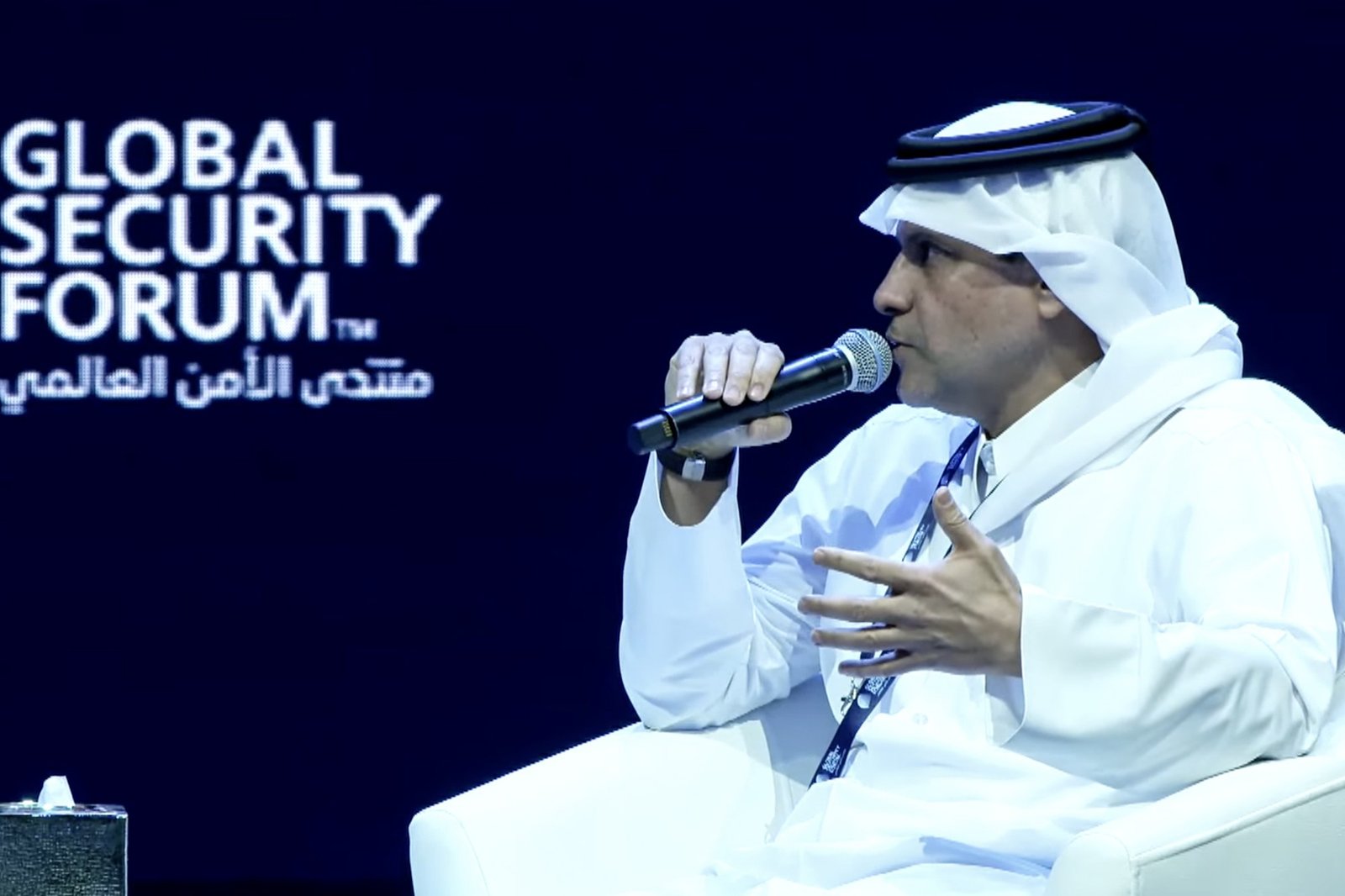Sheikh Saoud bin Abdulrahman Al Thani speaking into a microphone on stage at the Global Security Forum in Doha