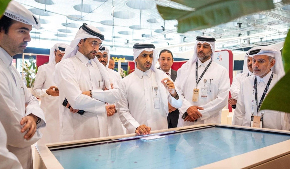 Officials view a digital display at the fourth Qatar Real Estate Forum in Doha