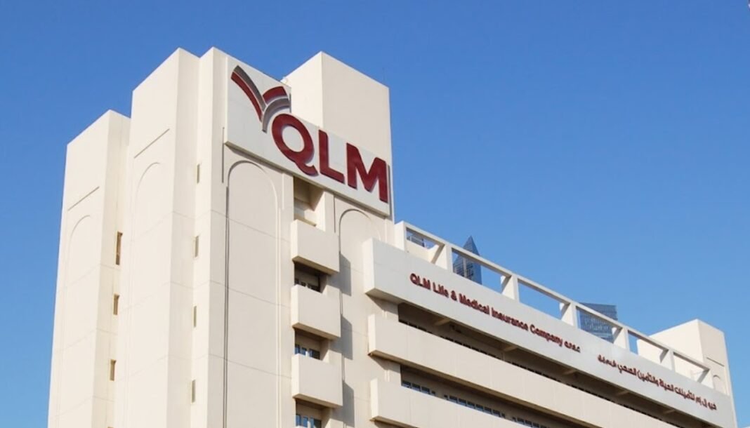 The QLM Life and Medical Insurance Company headquarters building in Doha under a blue sky