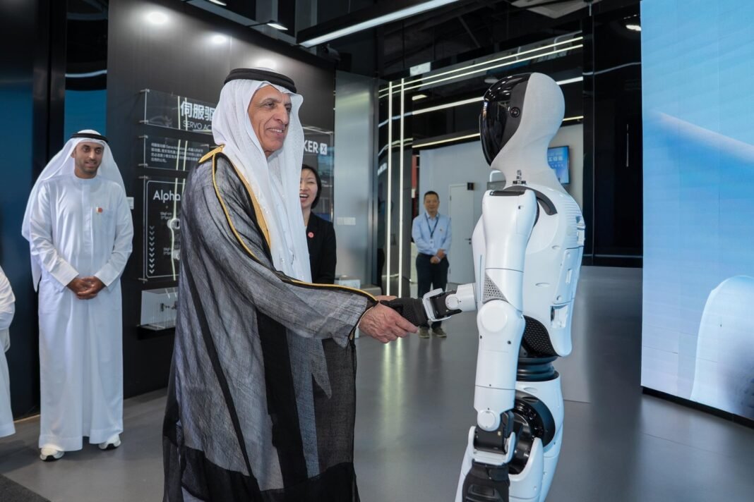 Sheikh Saud bin Saqr Al Qasimi, Ruler of Ras Al Khaimah, shakes hands with a UBTECH humanoid robot in Shenzhen, China