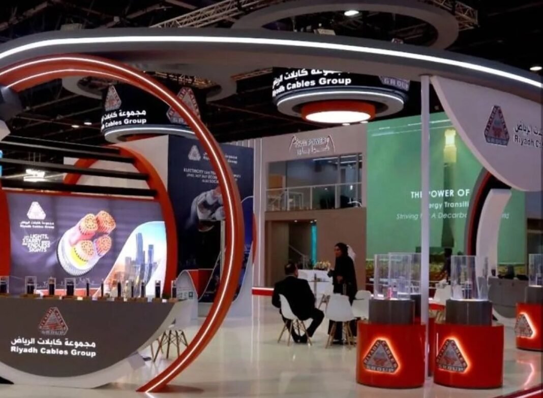 Riyadh Cables Group pavilion with cable samples on display at an exhibition