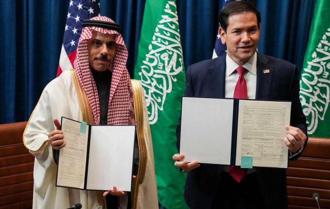 Saudi Foreign Minister Prince Faisal bin Farhan and US Secretary of State Marco Rubio hold up signed Expo 2030 Riyadh participation documents