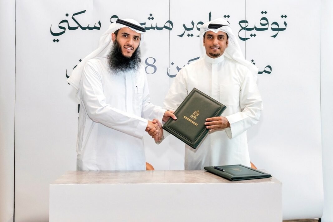 Executives from Securities House and Asas Makeen shake hands at the signing of their Riyadh residential project agreement