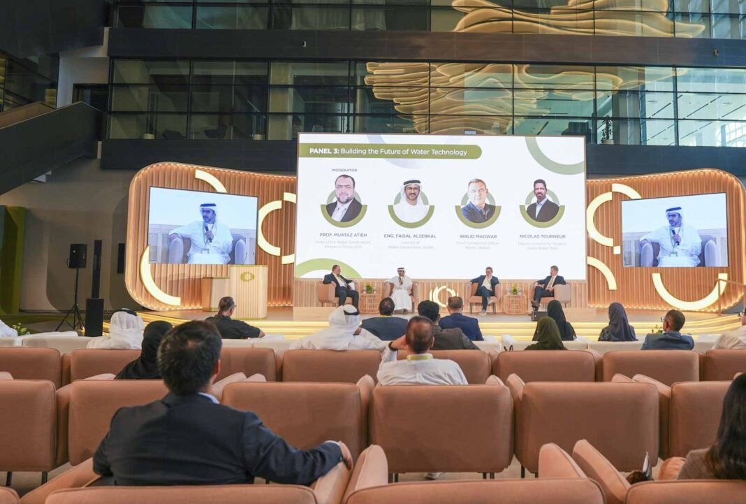 A panel on the future of water technology on stage at the Sharjah: Future Station forum, with an audience seated in front