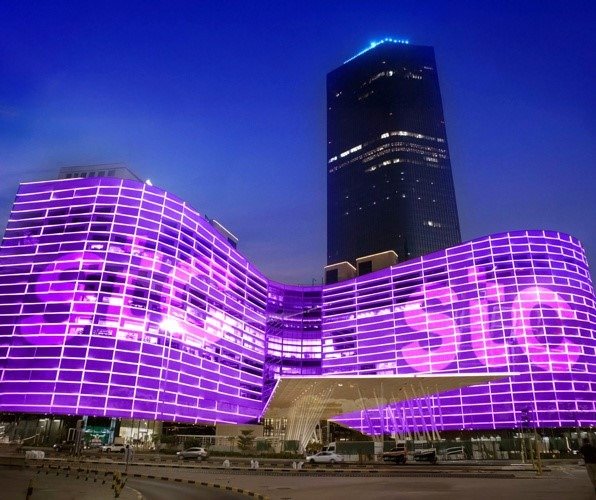 The illuminated headquarters of Kuwait Telecommunications Company stc in Kuwait City at night