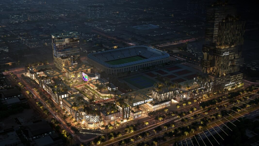 Night-time rendering of the Sumou Park mixed-use development beside a stadium in Riyadh