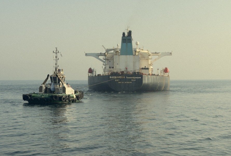 A tug and an oil tanker at sea off Fujairah