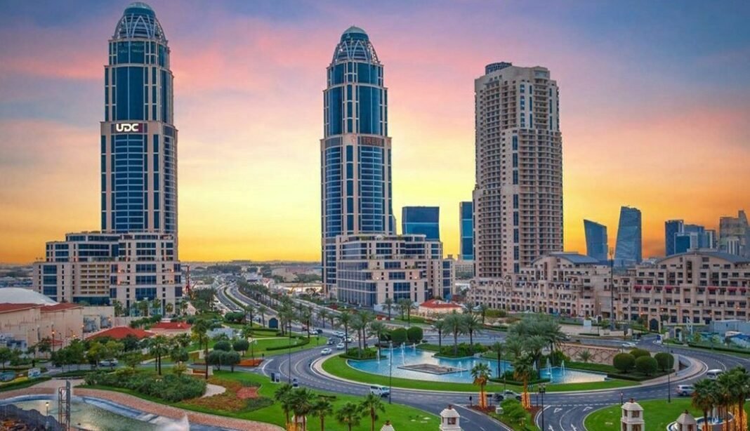 Towers and a roundabout at The Pearl Island in Doha at sunset