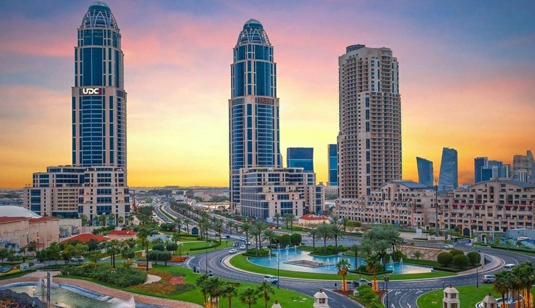 Towers and a roundabout at The Pearl Island in Doha at sunset