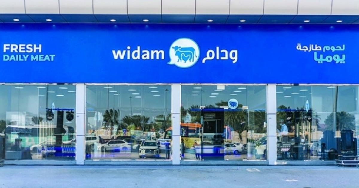 The front of a Widam fresh meat store in Qatar with blue signage in English and Arabic